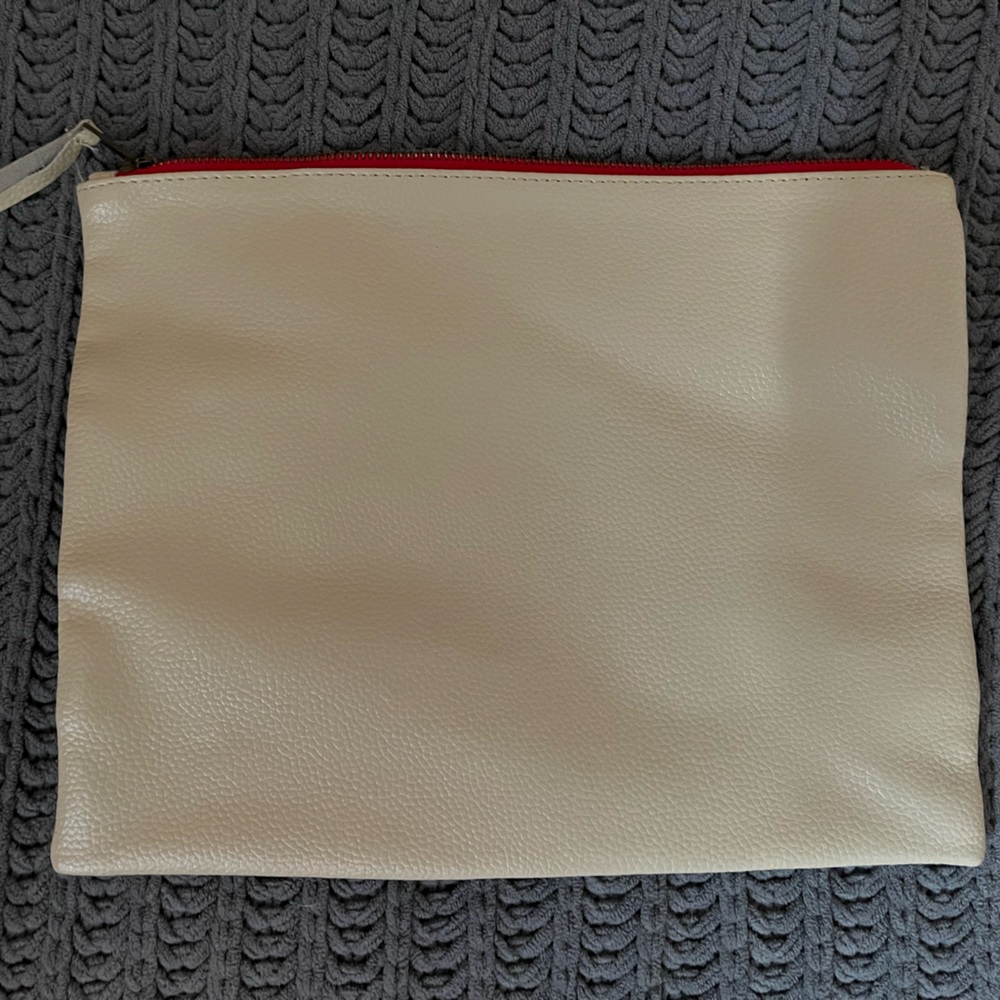 Cream with red zipper detail leather pouch